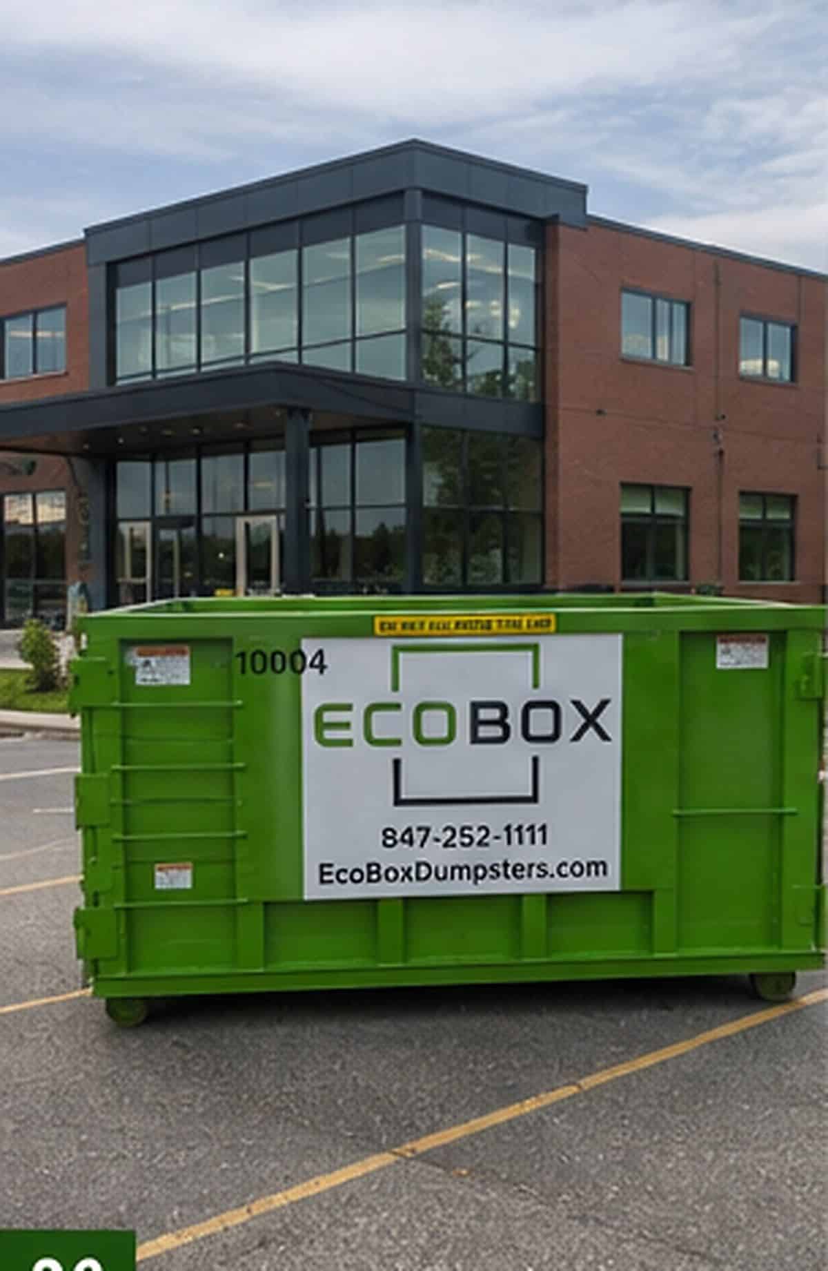 A roll-off dumpster outside a commercial building during a renovation