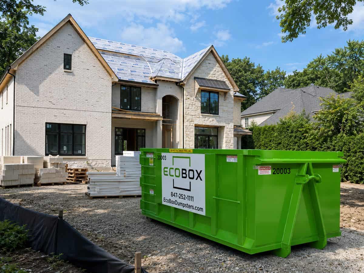 A roll-off dumpster at a house under construction