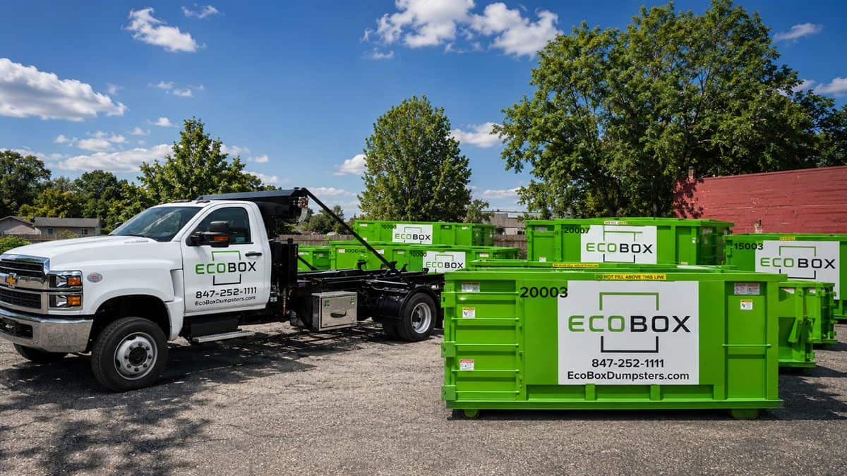 EcoBox roll-off containers and a delivery truck in the yard