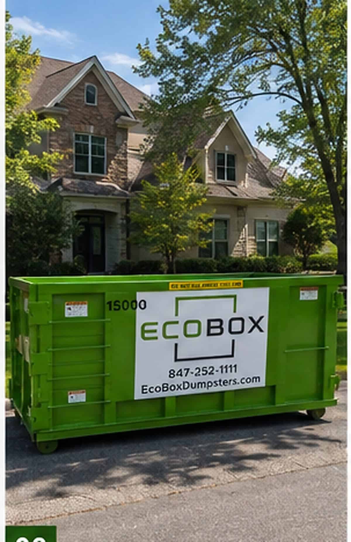 Green EcoBox dumpster outside a house during a renovation