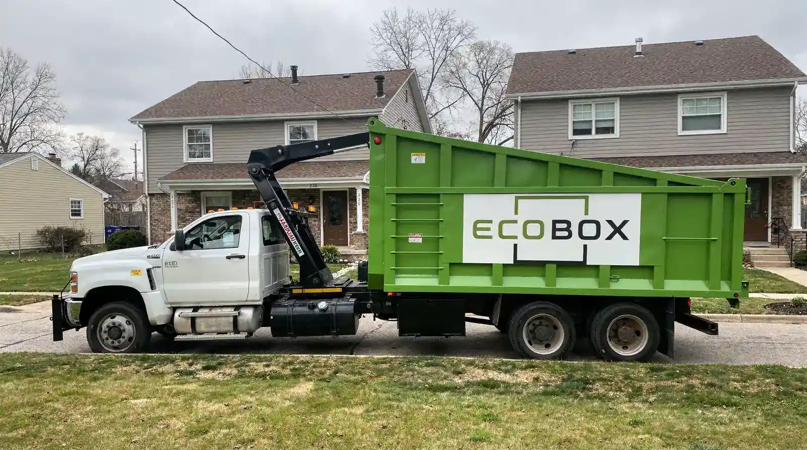 A roll-off dumpster is the open-top container delivered and picked up by specialized trucks, as